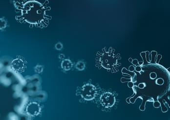 Darstellung des Covid-19-Virus vor blauem Hintergrund